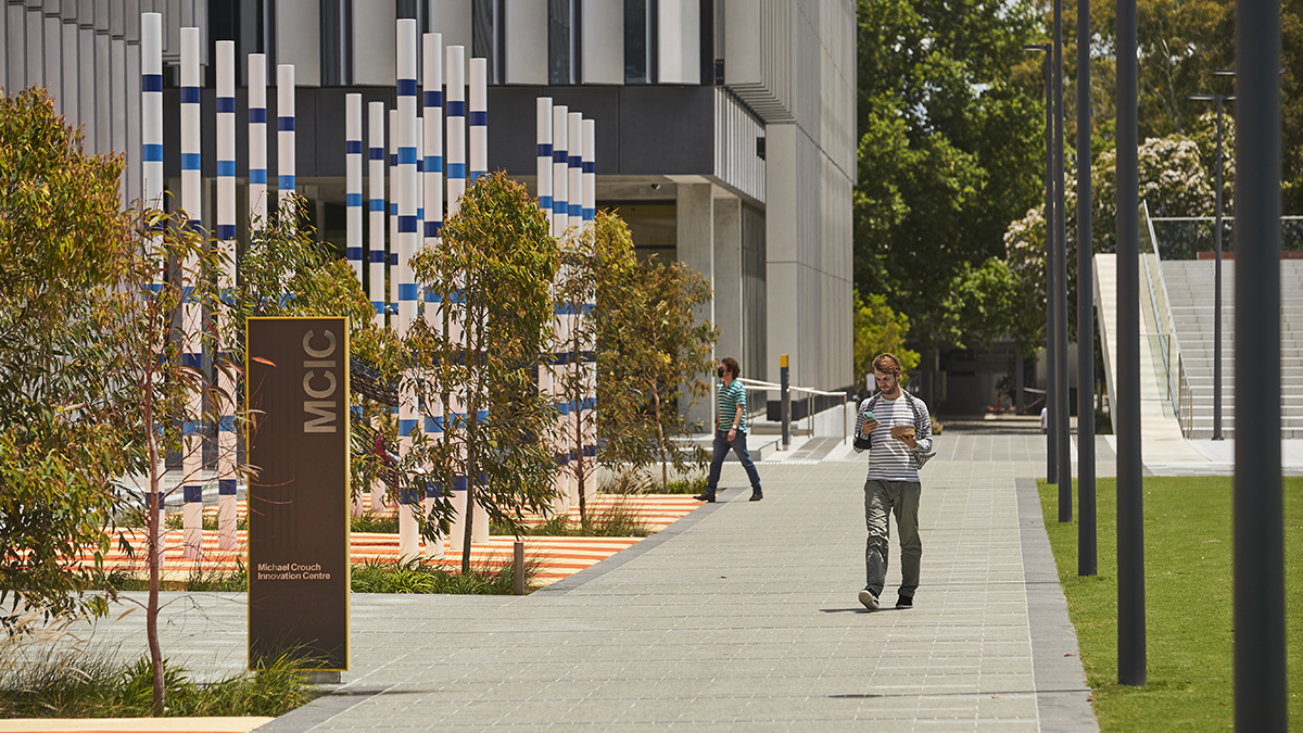 A man walking past the MCIC