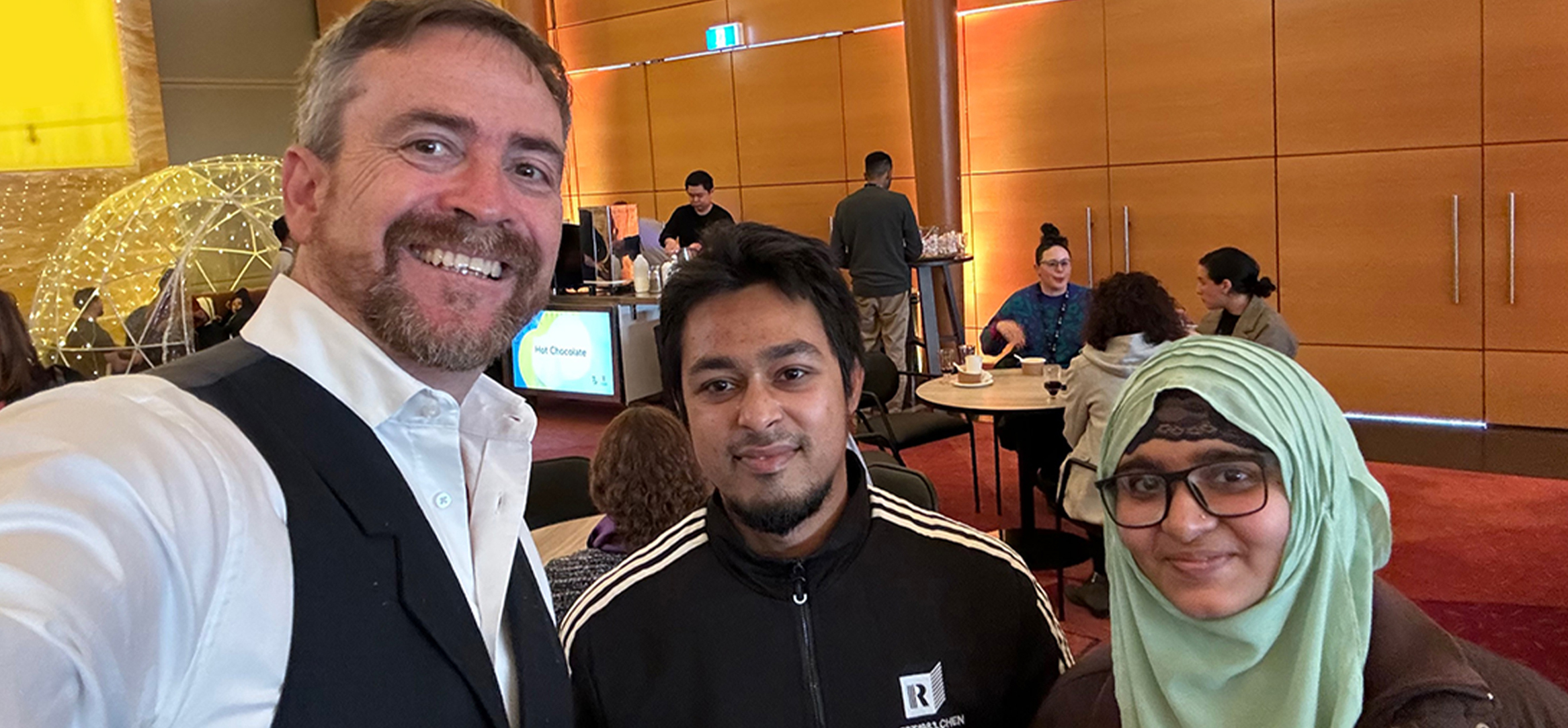 Above: VC Attila Brungs with postgraduate research students Md. Anik Hasan and Sofia Payel, School of Materials Science & Engineering at Winter Warmers.