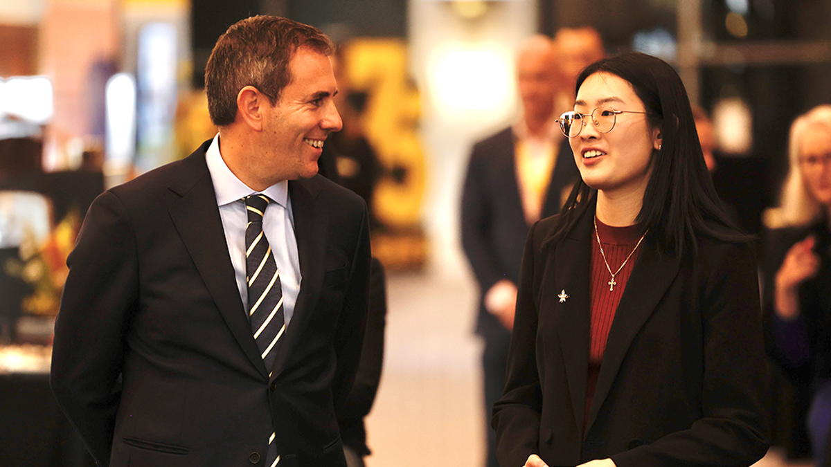 UNSW student Angela Le speaks with Federal Treasurer Dr Jim Chalmers at the Canberra showcase.