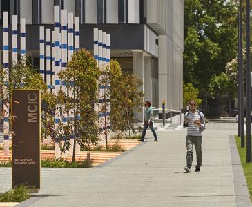 A man walking past the MCIC