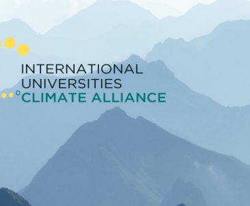 International Universities Climate Alliance logo over a photo of grey mountains