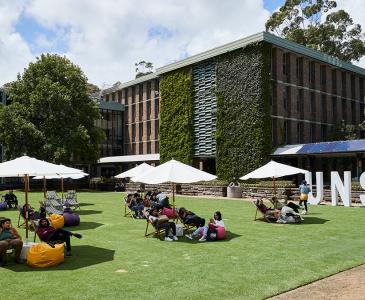 People relaxing on Library Lawn at UNSW