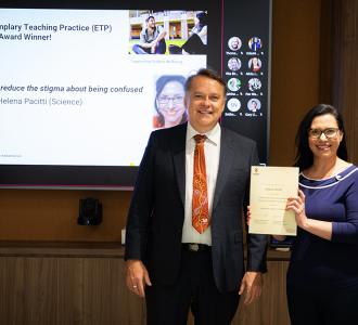 Helena Pacitti receiving her Exemplary Teaching Practice Award from the Scientia Education Academy’s Deputy Director Peter Heslin